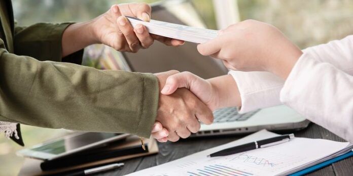 Business people shaking hands, finishing up meeting. businessman