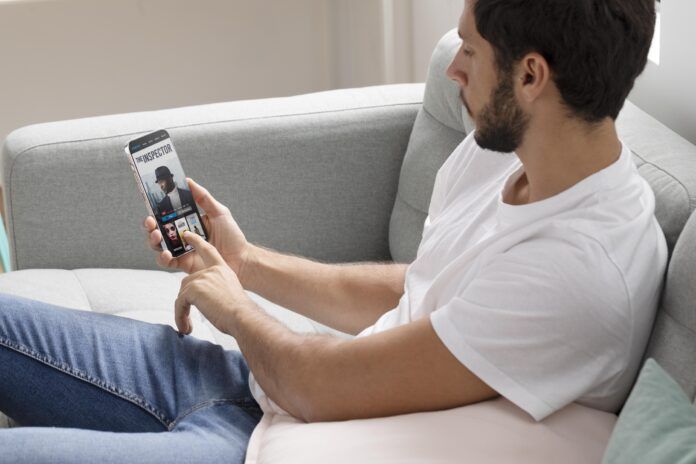 man-watching-his-favorite-movie-smartphone