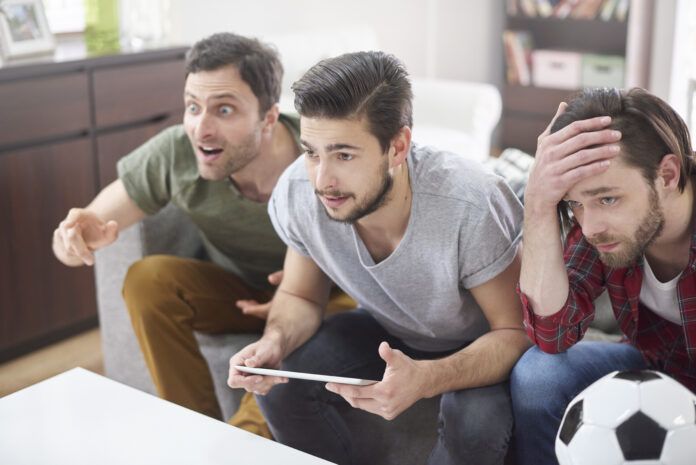 Very disappointed men after a soccer match